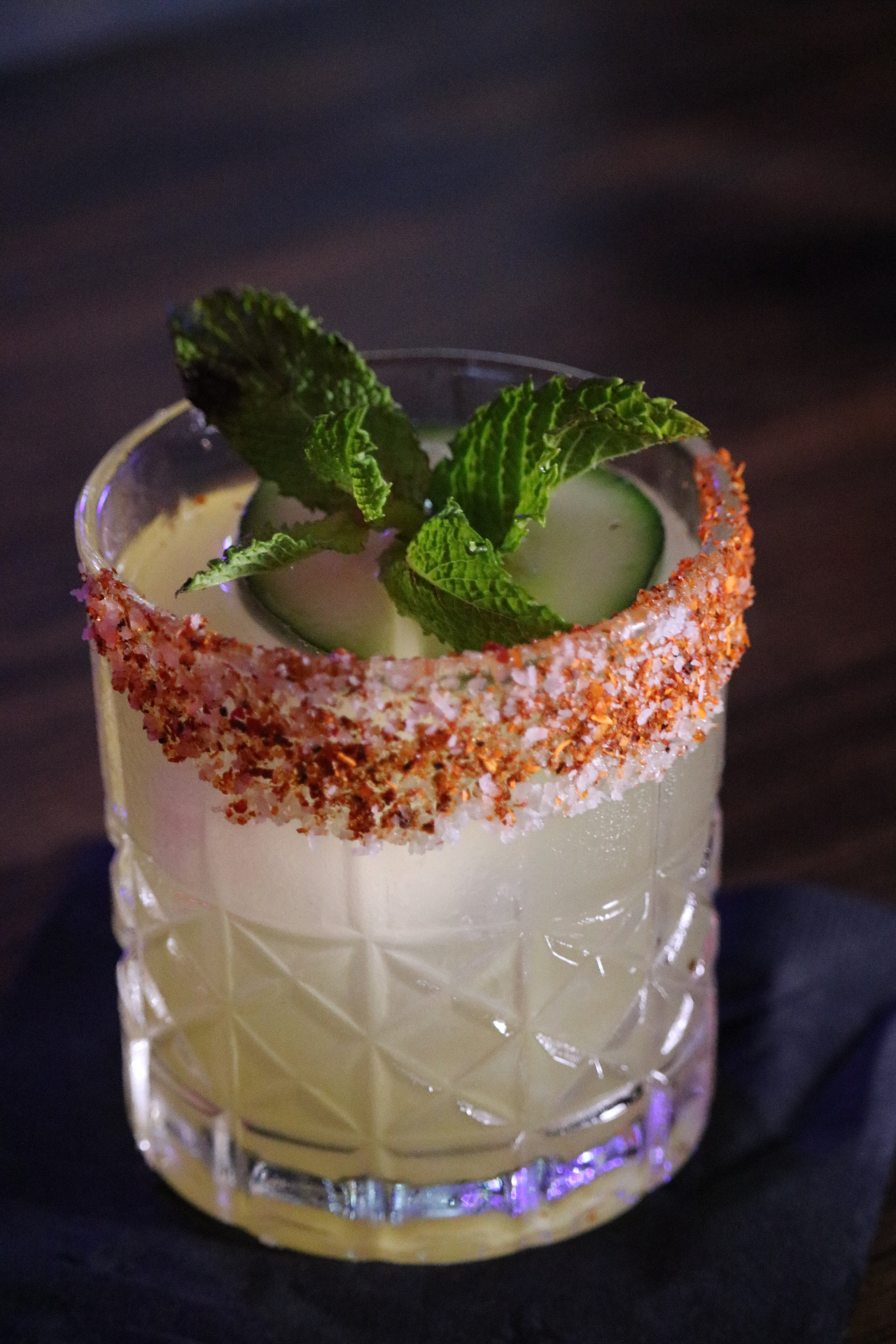 Chili-salt rimmed cocktail with mint and cucumber served by Dos Santos Mobile Bar